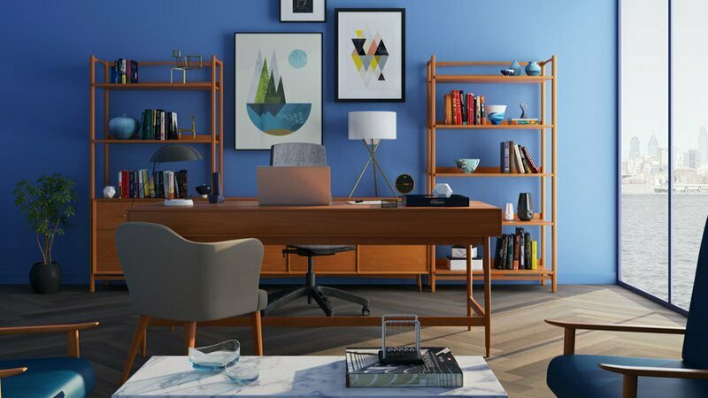 brown-wooden-desk-with-rolling-chair-and-shelves-near-window